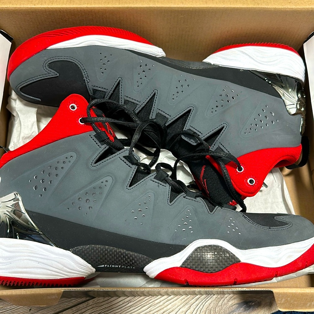 Grey, red, black and white Mens Jordans barely used